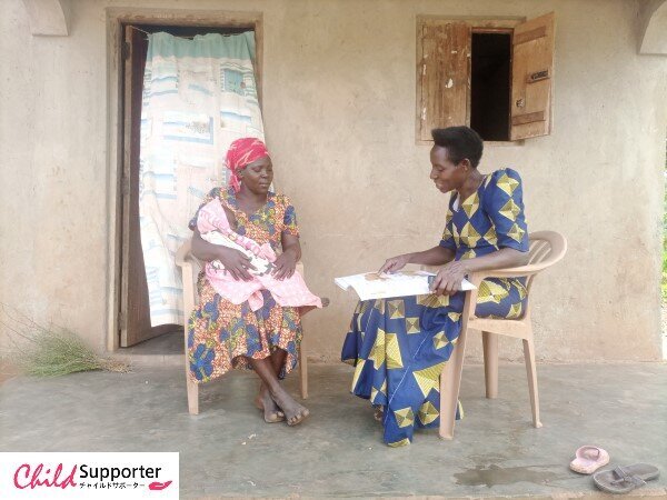 Racheal, a Community Change Agent (right) conducting a follow up visit to Salama.jpg